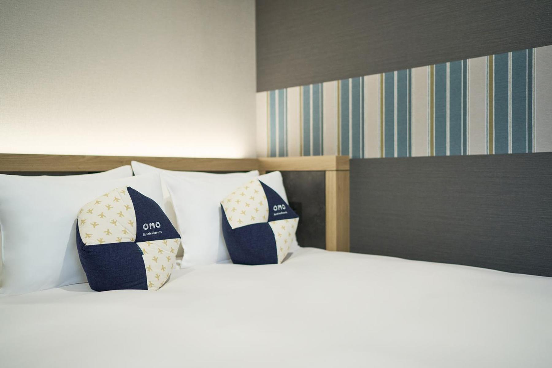 Omo Kansai Airport By Hoshino Resorts 泉佐野 外观 照片 A bed at a hotel